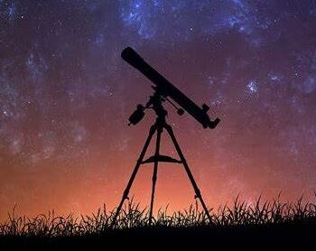 refractor telescope under a starry sky