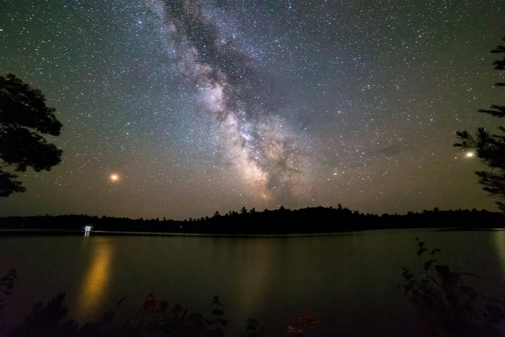 calm lake under the night sky